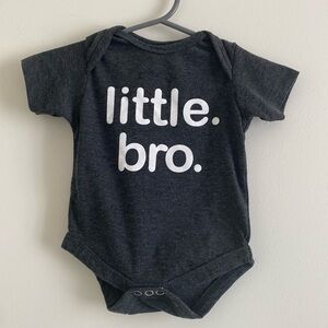 Unordinary Toddler ‘little. bro.’ baby Onesie